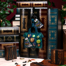 Load image into Gallery viewer, Between the Covers Bookbinders Key Charm